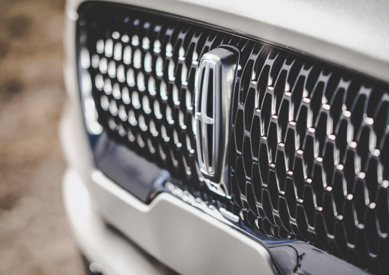 The grille of the 2024 Lincoln Aviator® Reserve model with an eye-catching repeated field of Lincoln Star logo shapes | Vision Lincoln in Wahpeton ND