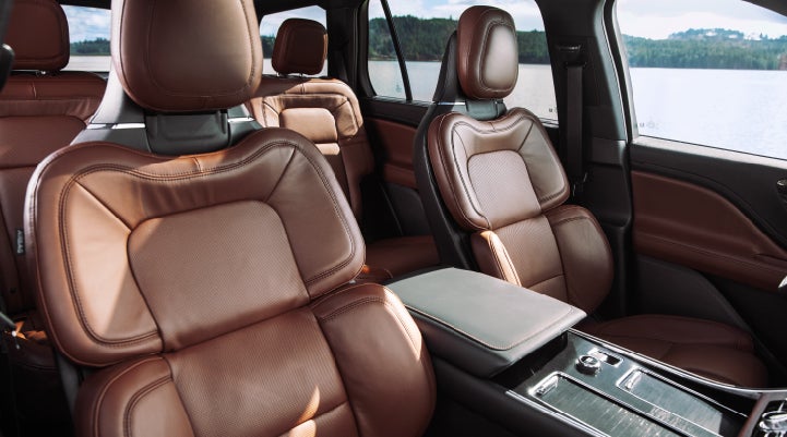 The front row's Perfect Position Seats in a 2024 Lincoln Aviator® Reserve model with Ebony Roast interior | Vision Lincoln in Wahpeton ND