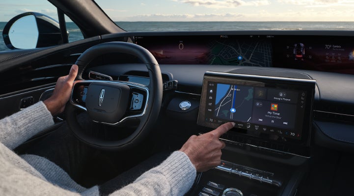 The driver of a 2024 Lincoln Nautilus® SUV interacts with the new Lincoln Digital Experience. | Vision Lincoln in Wahpeton ND