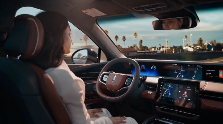 A person is shown driving hands-free on the highway with available Lincoln BlueCruise technology. | Vision Lincoln in Wahpeton ND
