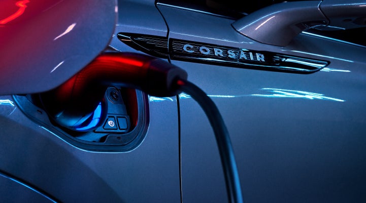 A charger plugged into the charging port of a 2024 Lincoln Corsair® Plug-in Hybrid model. | Vision Lincoln in Wahpeton ND